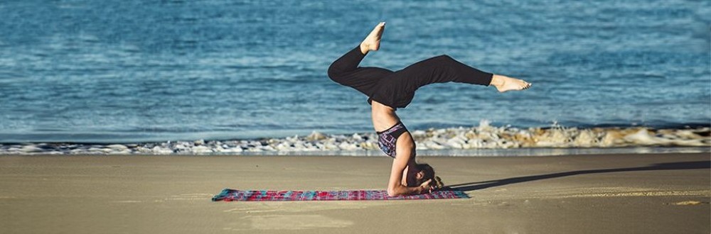 Aktiv und Fit mit Yoga im Wellnessurlaub Morgendliche Yoga-Praxis am Strand